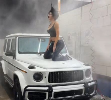 Woman on hood Mercedes G-Class nice washing
