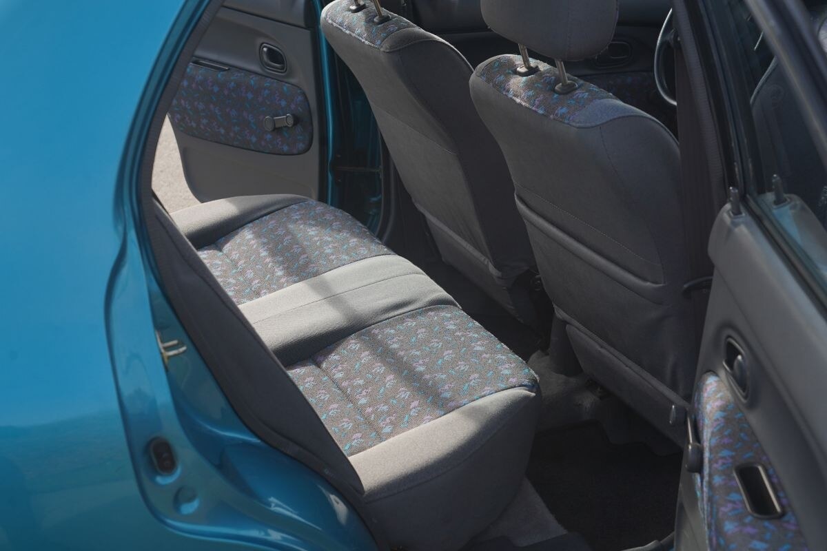 Mazda 121 with bear rims